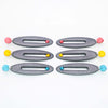 Imagen de los pendientes hechos a mano, modelo Esencia en tres colores sobre fondo blanco, colocados en forma rectangular 